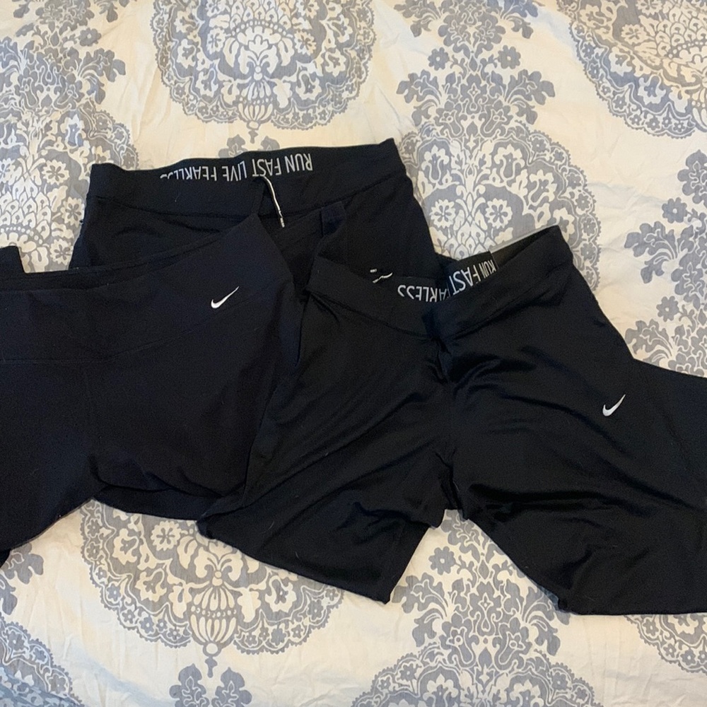 3 pairs of black nike capris